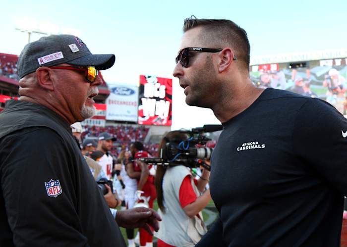 Buccaneers head coach Bruce Arians (left), who had a lengthy tenure with the Cardinals, greets Cardinals coach Kliff Kingsbury after a 2019 game.